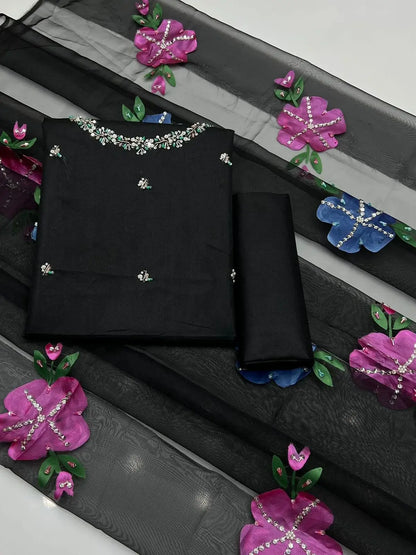 Wedding Collection unstitched dress set with black fabric and colorful floral embroidery.